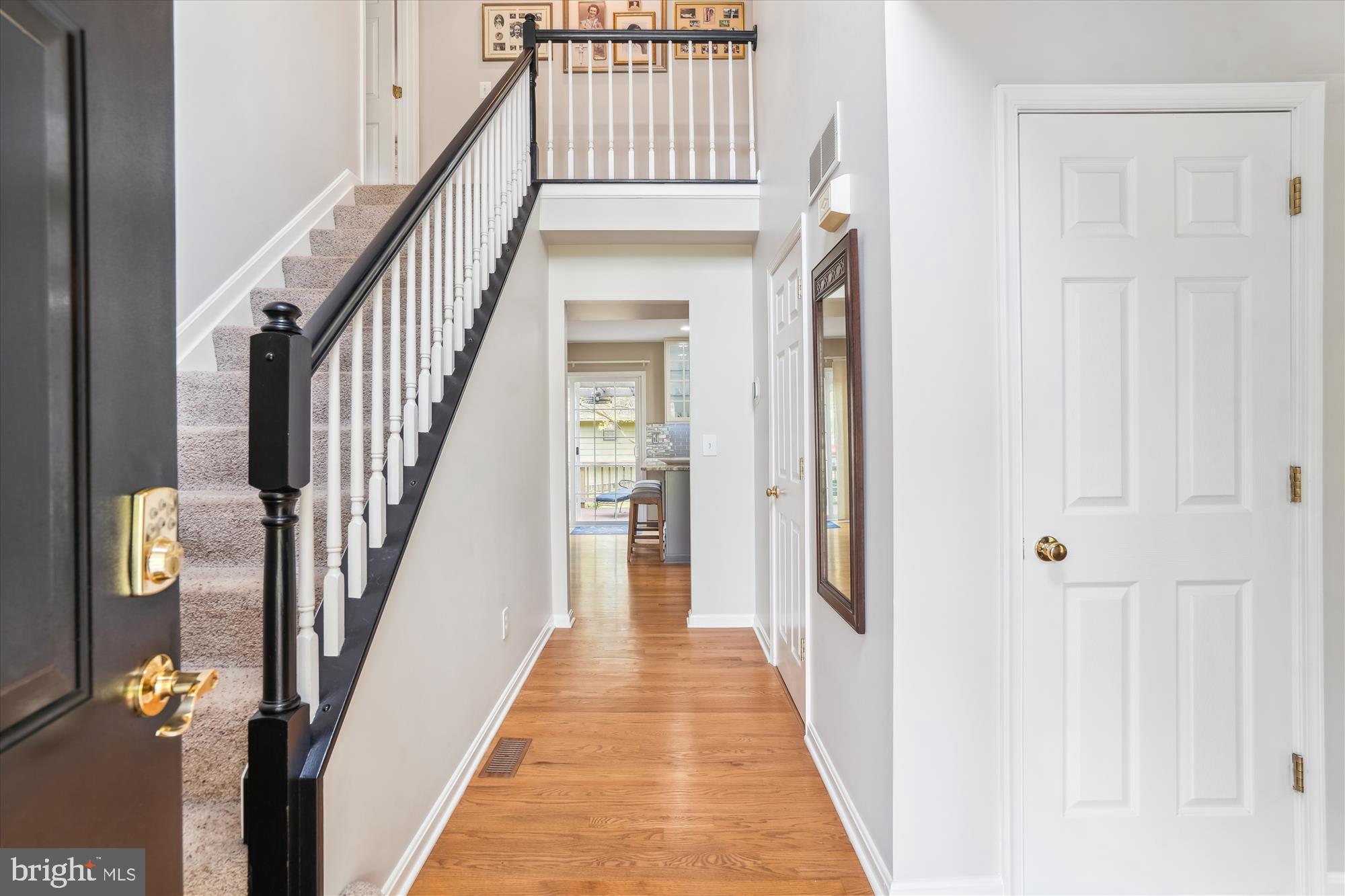 1043 Skyview Drive Annapolis, MD 21409 - Photo 6 of 71 a view of a hallway with wooden floor and staircase