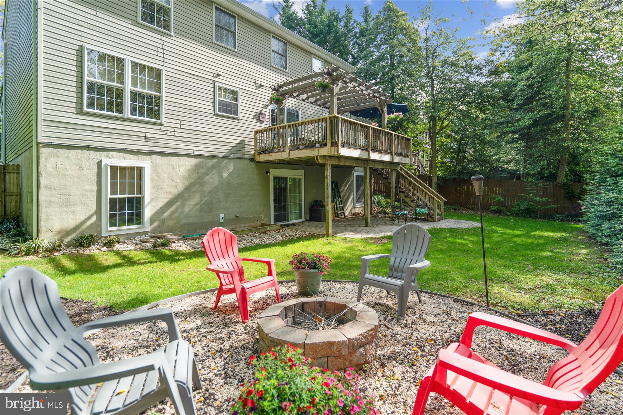 1043 Skyview Drive Annapolis, MD 21409 - Photo 64 of 71 a backyard of a house with yard fountain and outdoor seating