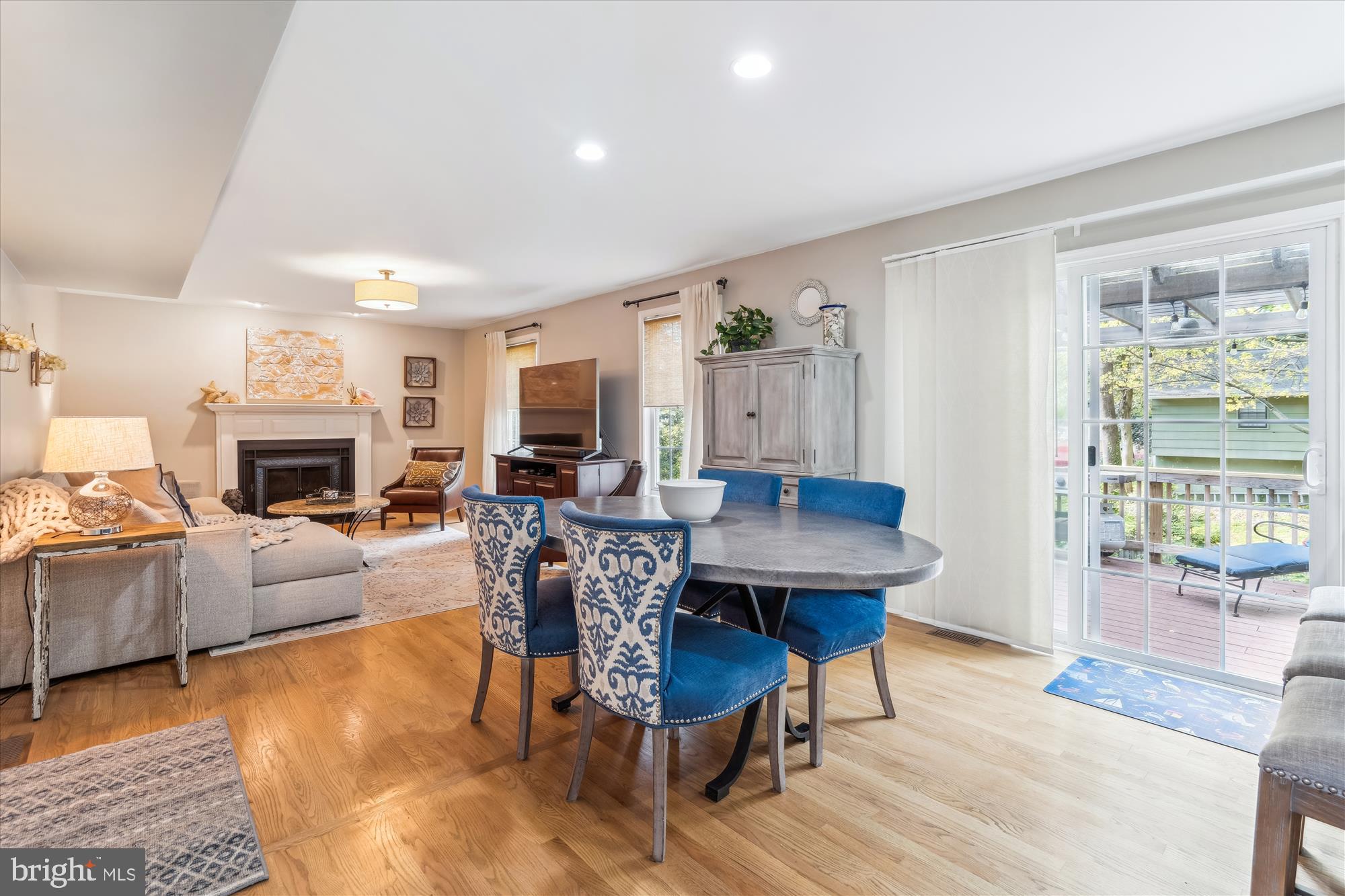1043 Skyview Drive Annapolis, MD 21409 - Photo 7 of 71 a living room with furniture a fireplace and a table