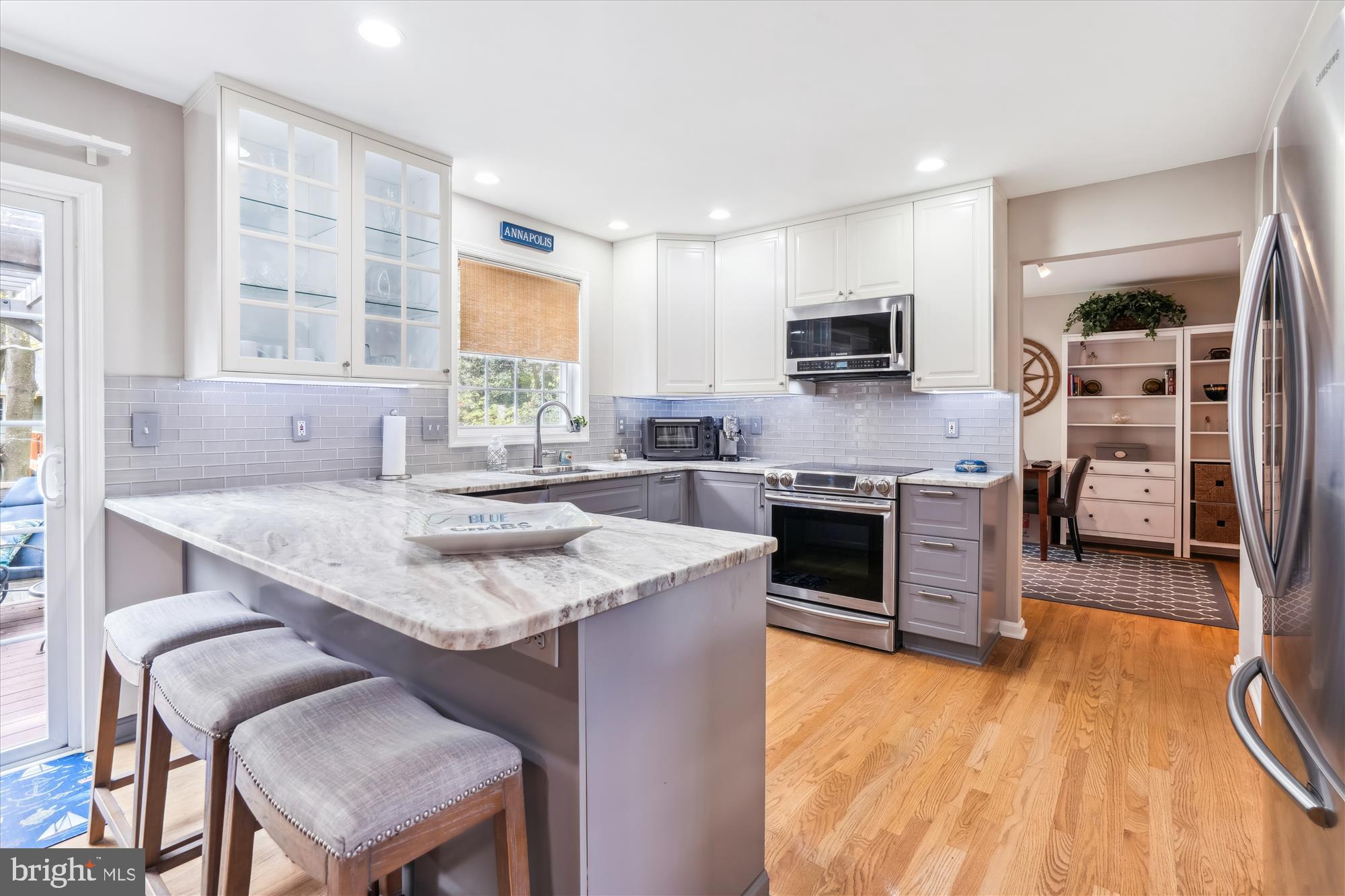 1043 Skyview Drive Annapolis, MD 21409 - Photo 8 of 71 a kitchen with stainless steel appliances granite countertop a stove top oven a sink and a microwave