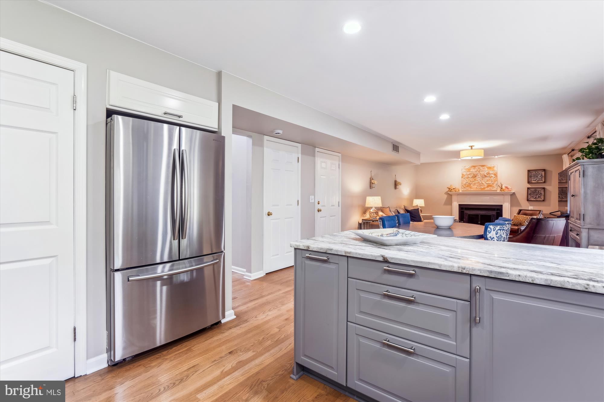 1043 Skyview Drive Annapolis, MD 21409 - Photo 10 of 71 a kitchen with kitchen island white cabinets and stainless steel appliances