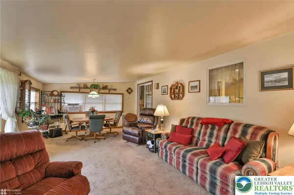 a room with water heater and a wooden cabinets