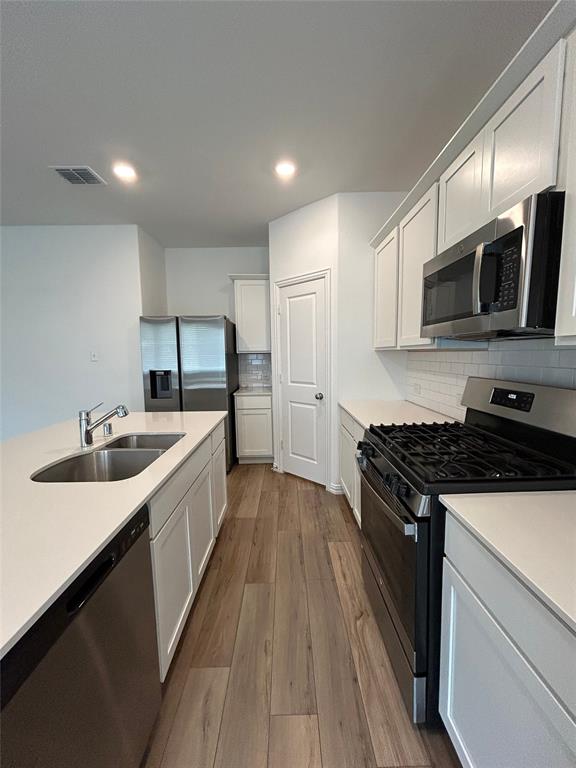 213 Post Oak Street Azle, TX 76020 - Photo 15 of 24 a kitchen with a sink stove and microwave