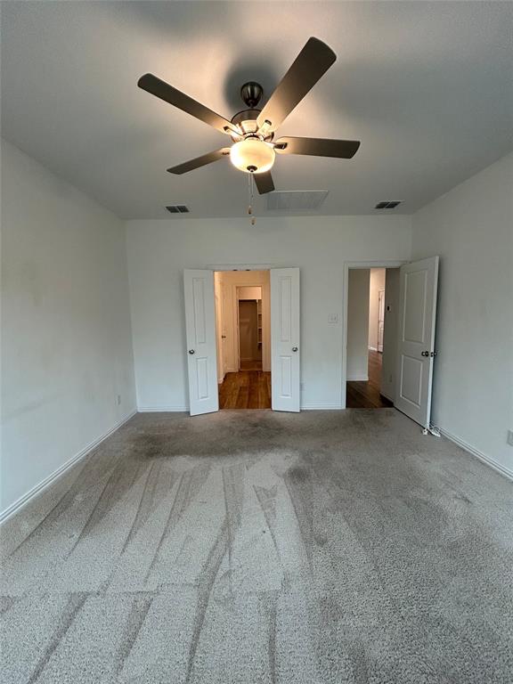 213 Post Oak Street Azle, TX 76020 - Photo 20 of 24 a view of an empty room with a chandelier fan