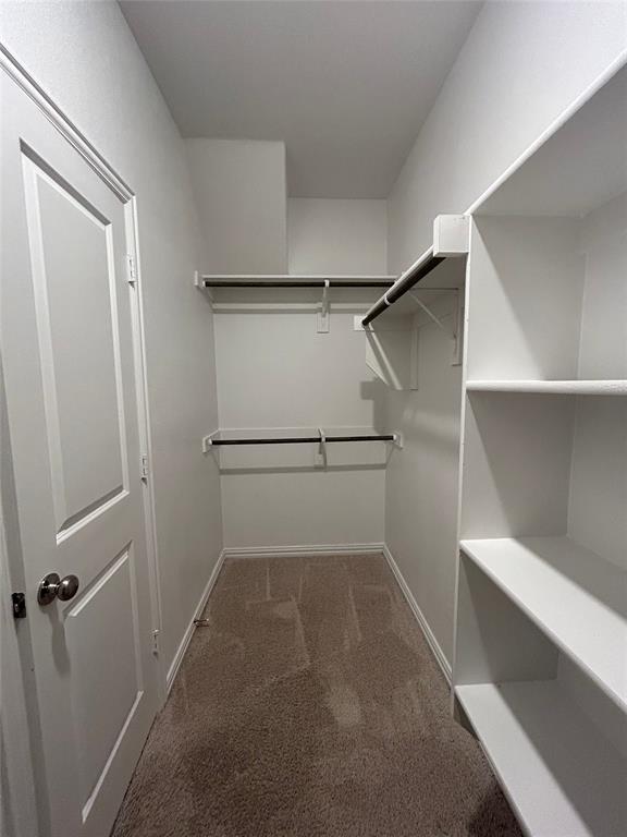 213 Post Oak Street Azle, TX 76020 - Photo 22 of 24 a view of a room with racks on the wall