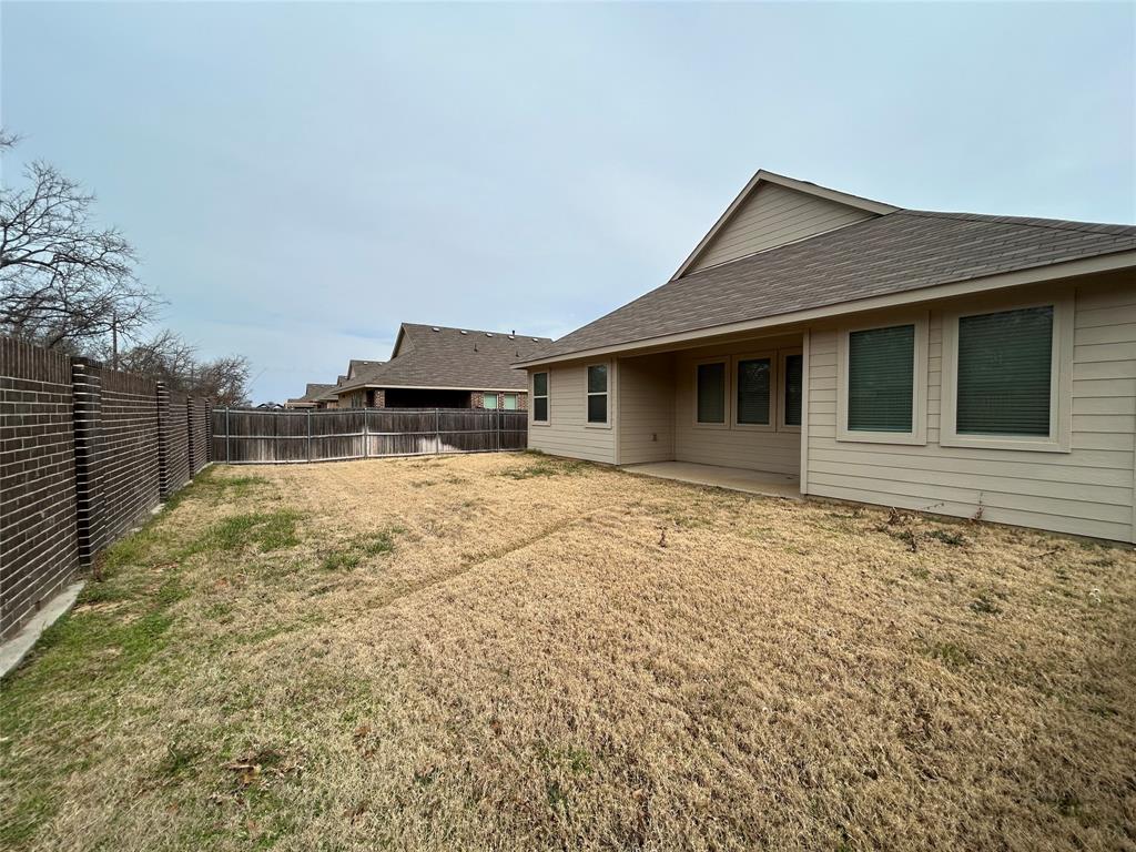 213 Post Oak Street Azle, TX 76020 - Photo 23 of 24 a front view of a house with a yard