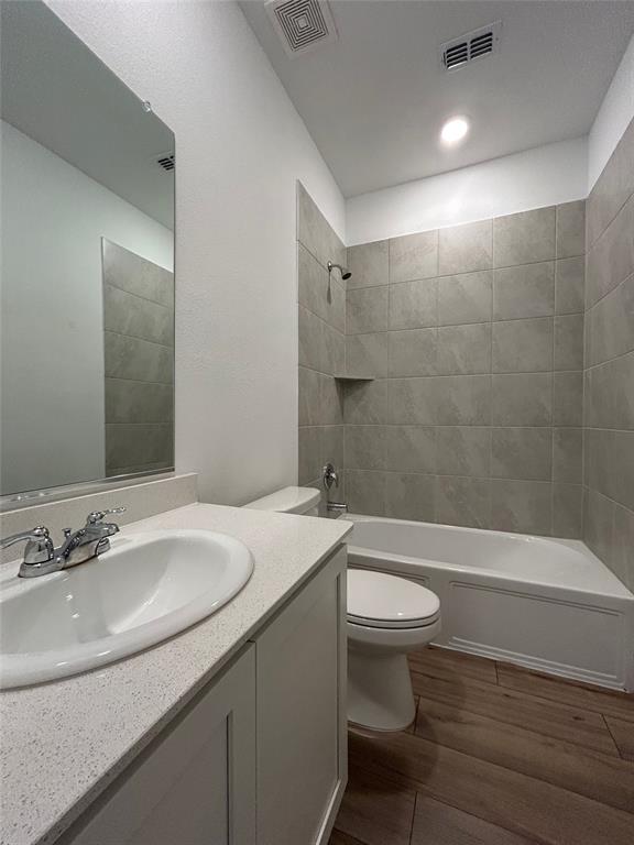 213 Post Oak Street Azle, TX 76020 - Photo 6 of 24 a bathroom with a sink a toilet and a mirror