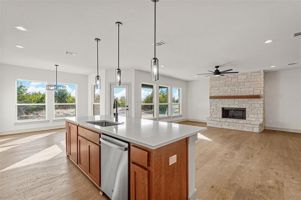 730 Evergreen Nevada, TX 75173 - Photo 12 of 40 a open kitchen with granite countertop a stove and a sink with granite countertops