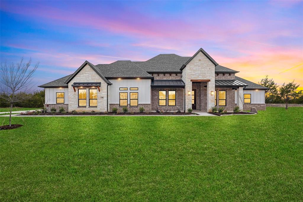 730 Evergreen Nevada, TX 75173 - Photo 3 of 40 a front view of a house with a yard