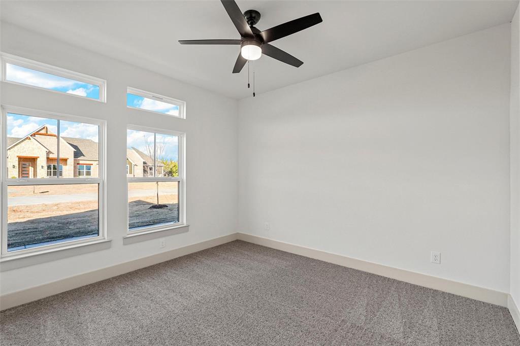 730 Evergreen Nevada, TX 75173 - Photo 33 of 40 an empty room with a window and a ceiling fan