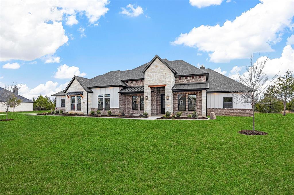 730 Evergreen Nevada, TX 75173 - Photo 39 of 40 a front view of a house with a garden