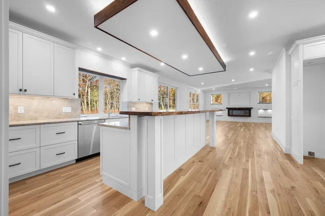 a kitchen with a sink and cabinets
