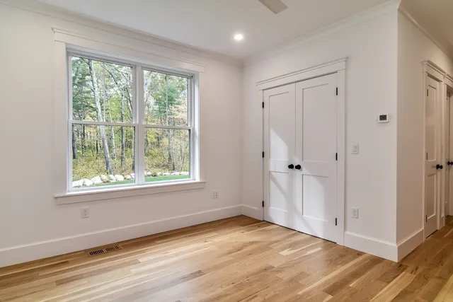 a living room with furniture and a mirror