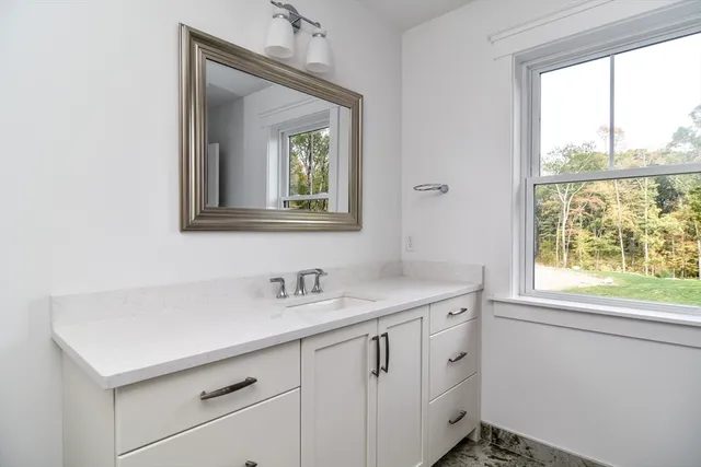 a spacious bedroom with a bed and a couch