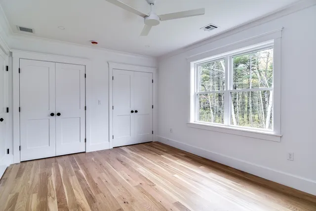 a bedroom with bed and a window