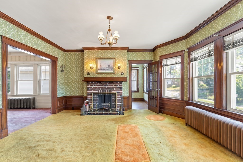 24 Fairbanks Road Milton, MA 02186 - Photo 11 of 19 a living room with furniture and a fireplace