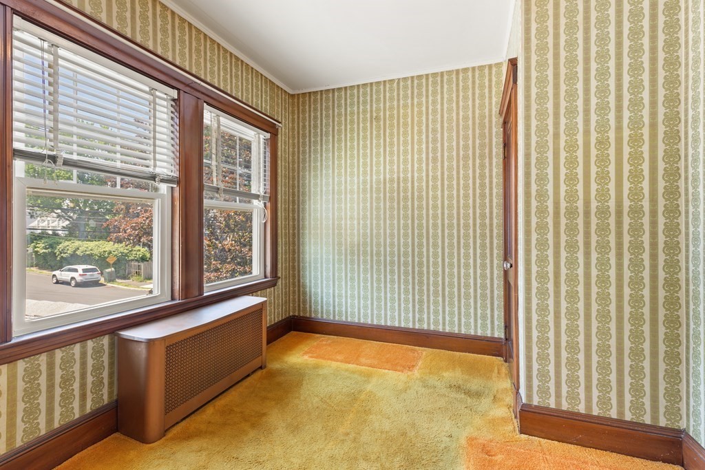 24 Fairbanks Road Milton, MA 02186 - Photo 12 of 19 a view of an empty room with a window