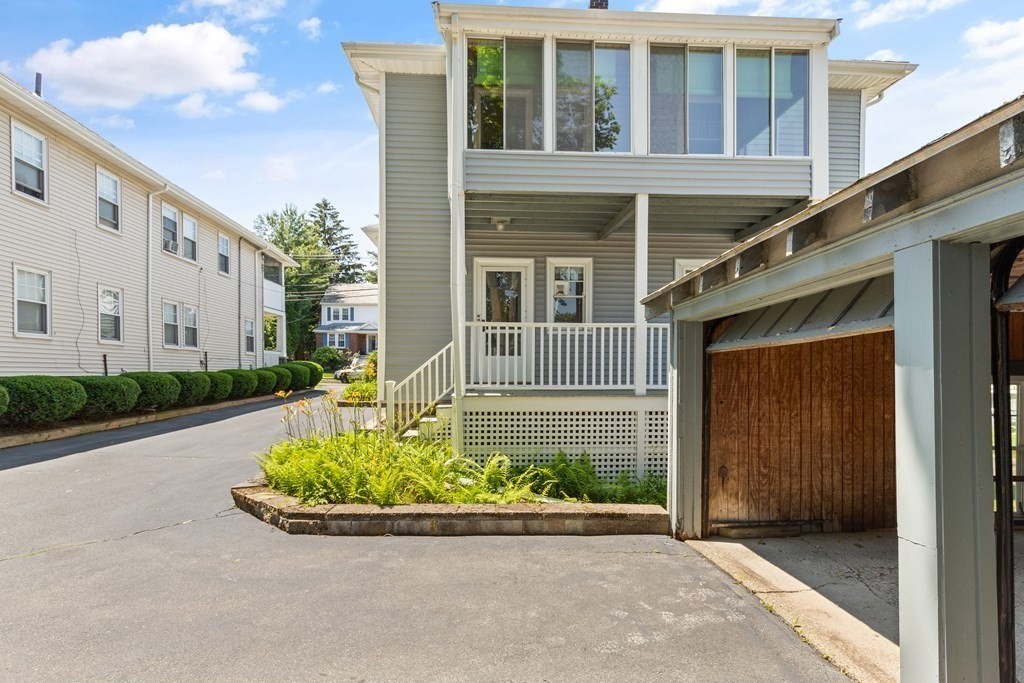 24 Fairbanks Road Milton, MA 02186 - Photo 18 of 19 front view of a house with a small yard