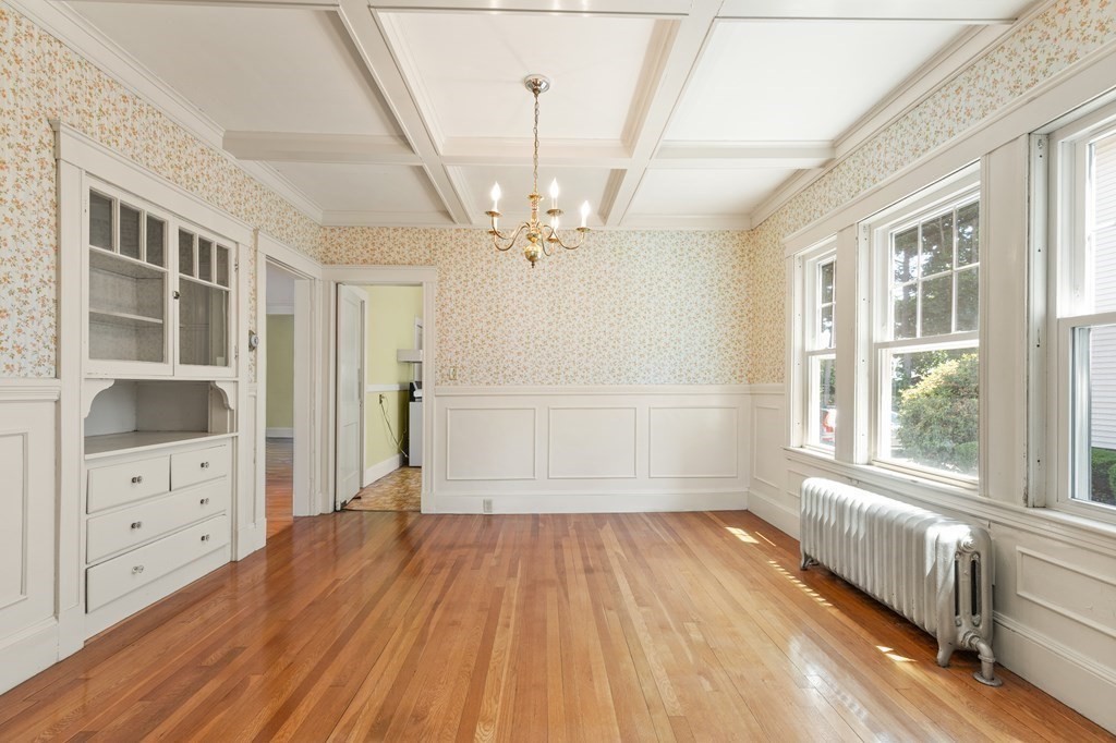 24 Fairbanks Road Milton, MA 02186 - Photo 4 of 19 wooden floor in an empty room with a window