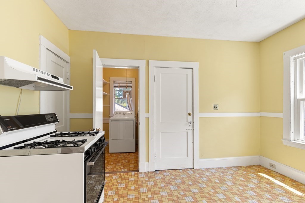24 Fairbanks Road Milton, MA 02186 - Photo 6 of 19 a view of a kitchen with a stove top oven