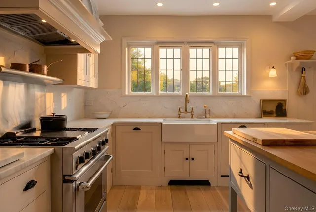 a kitchen that has a sink and a stove