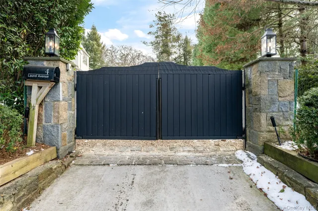 a view of house with backyard and wooden fence