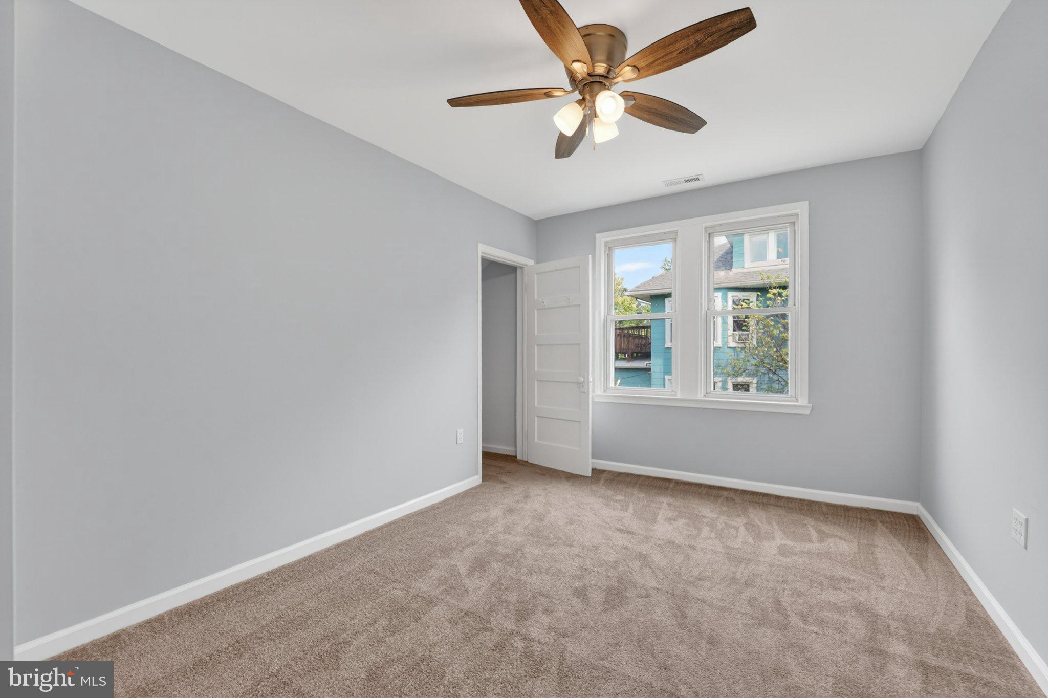 5312 Catalpha Road Baltimore, MD 21214 - Photo 52 of 59 an empty room with windows and fan