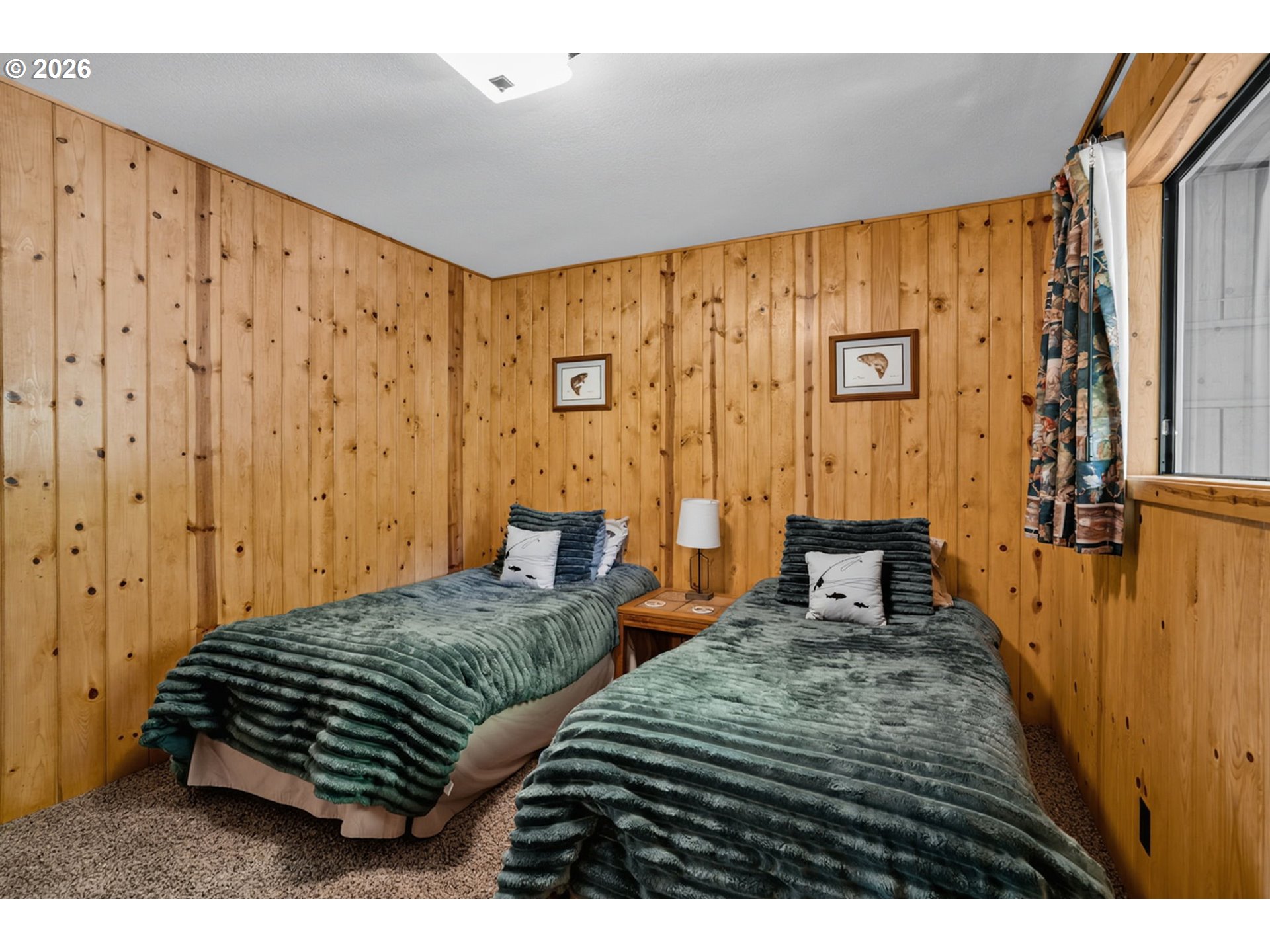 46725 Goodpasture Road Vida, OR 97488 - Photo 14 of 48 a bedroom with two beds and a chandelier