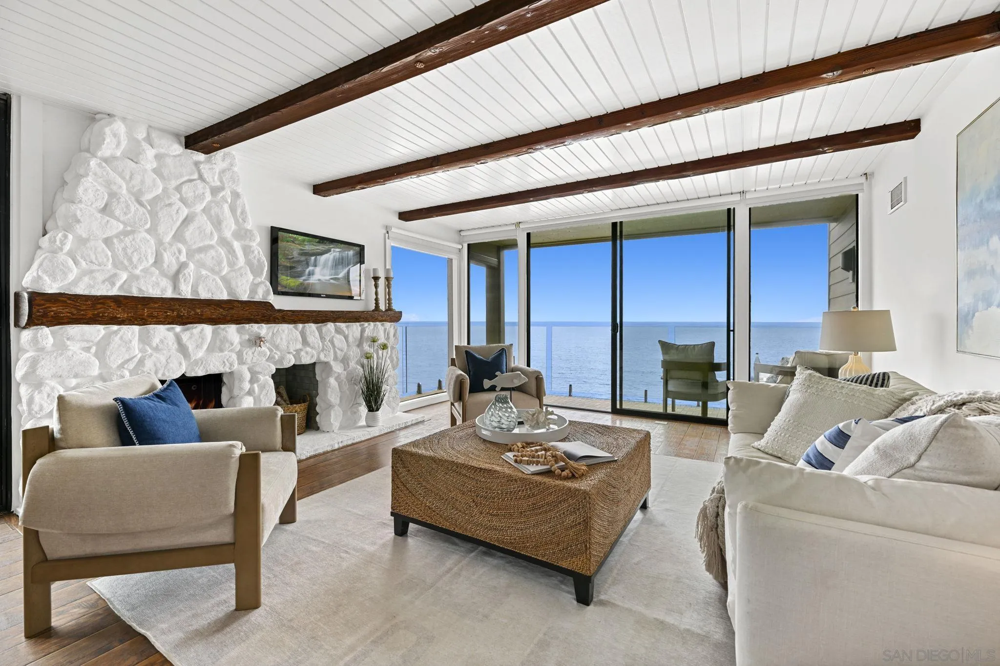 337 West I Street Encinitas, CA 92024 - Photo 12 of 58 a living room with furniture a fireplace and a flat screen tv