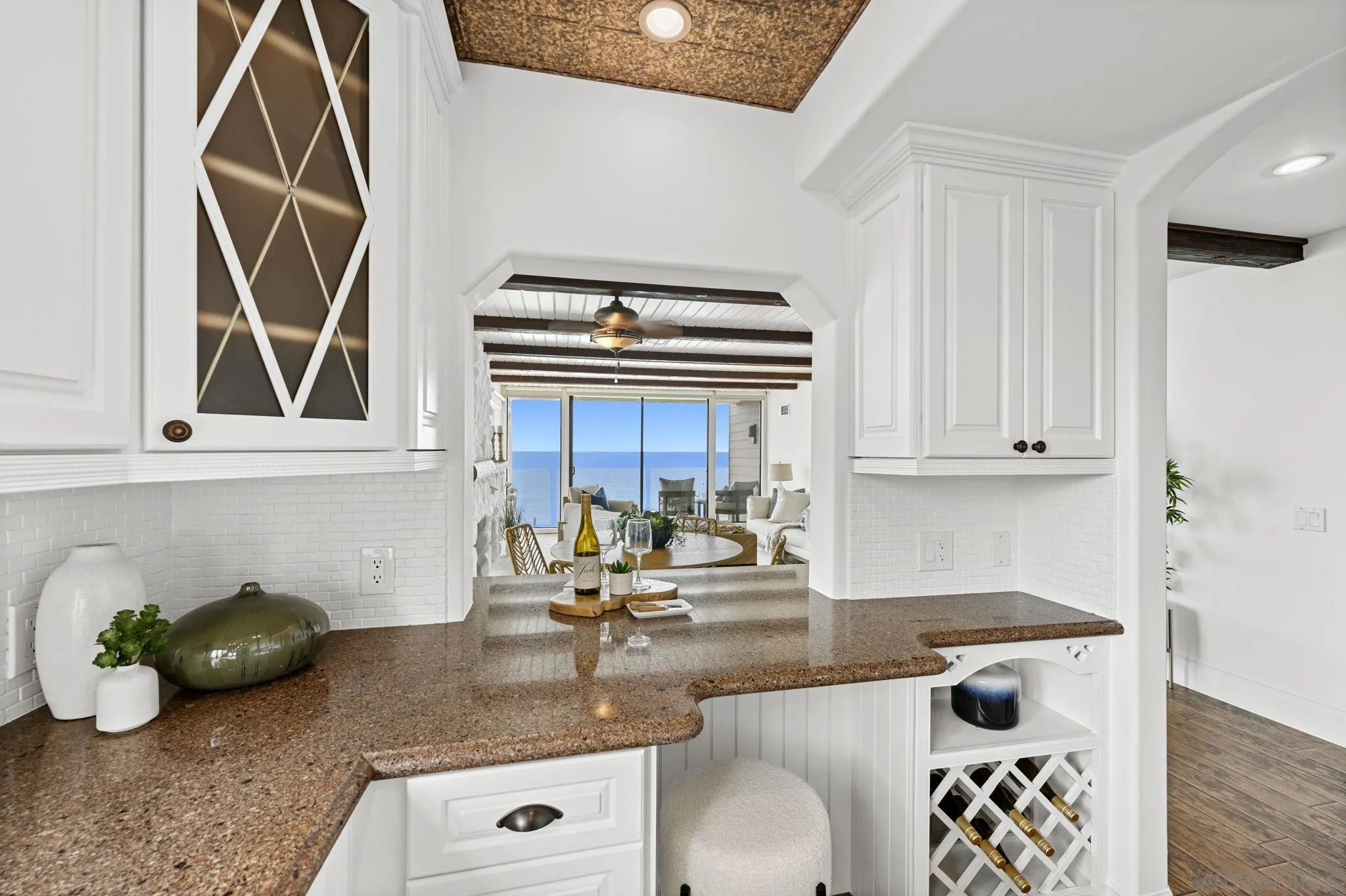 337 West I Street Encinitas, CA 92024 - Photo 17 of 58 a kitchen with granite countertop a sink a stove and a wooden cabinets