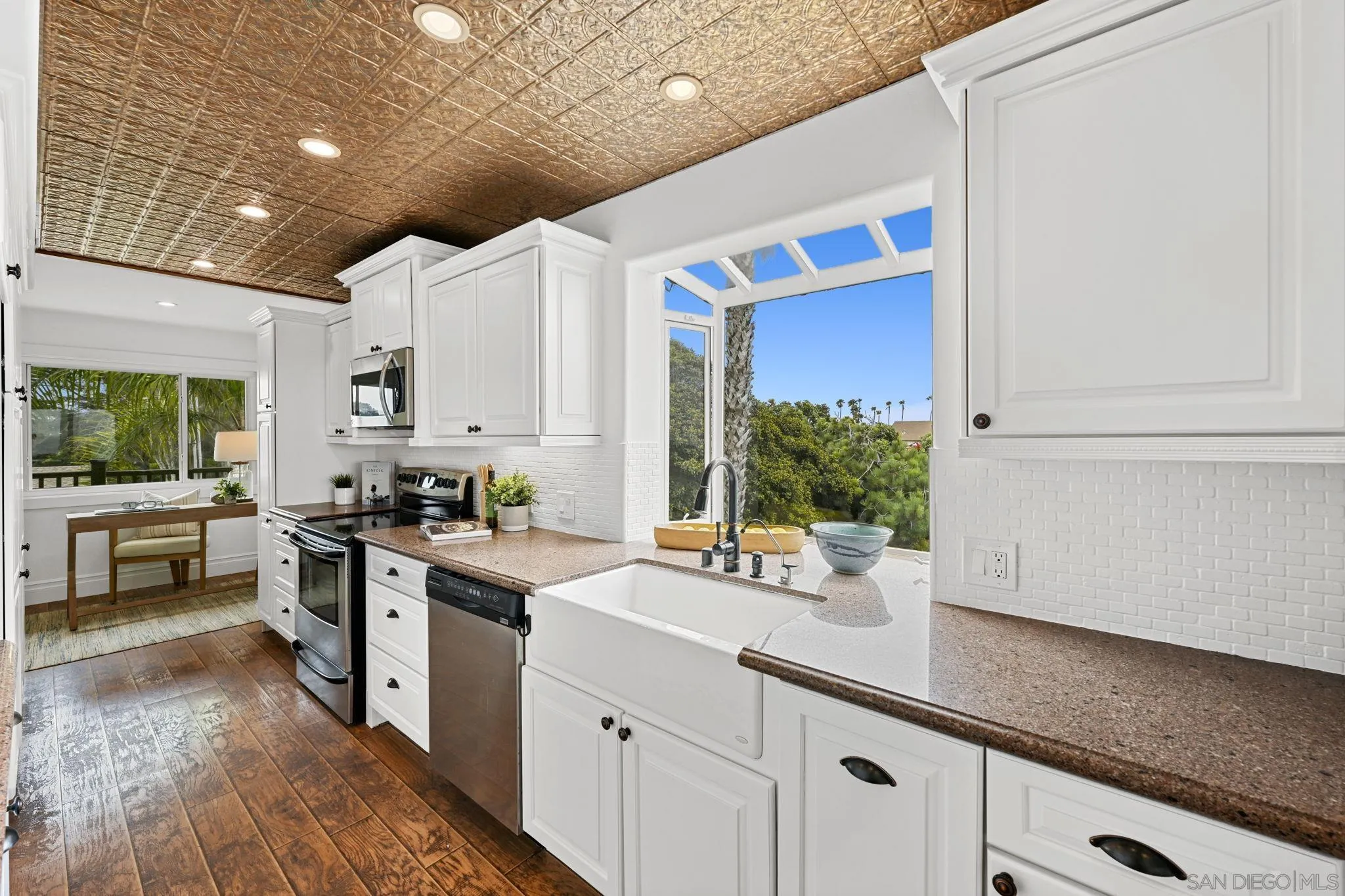 337 West I Street Encinitas, CA 92024 - Photo 18 of 58 a kitchen with a sink stove and cabinets