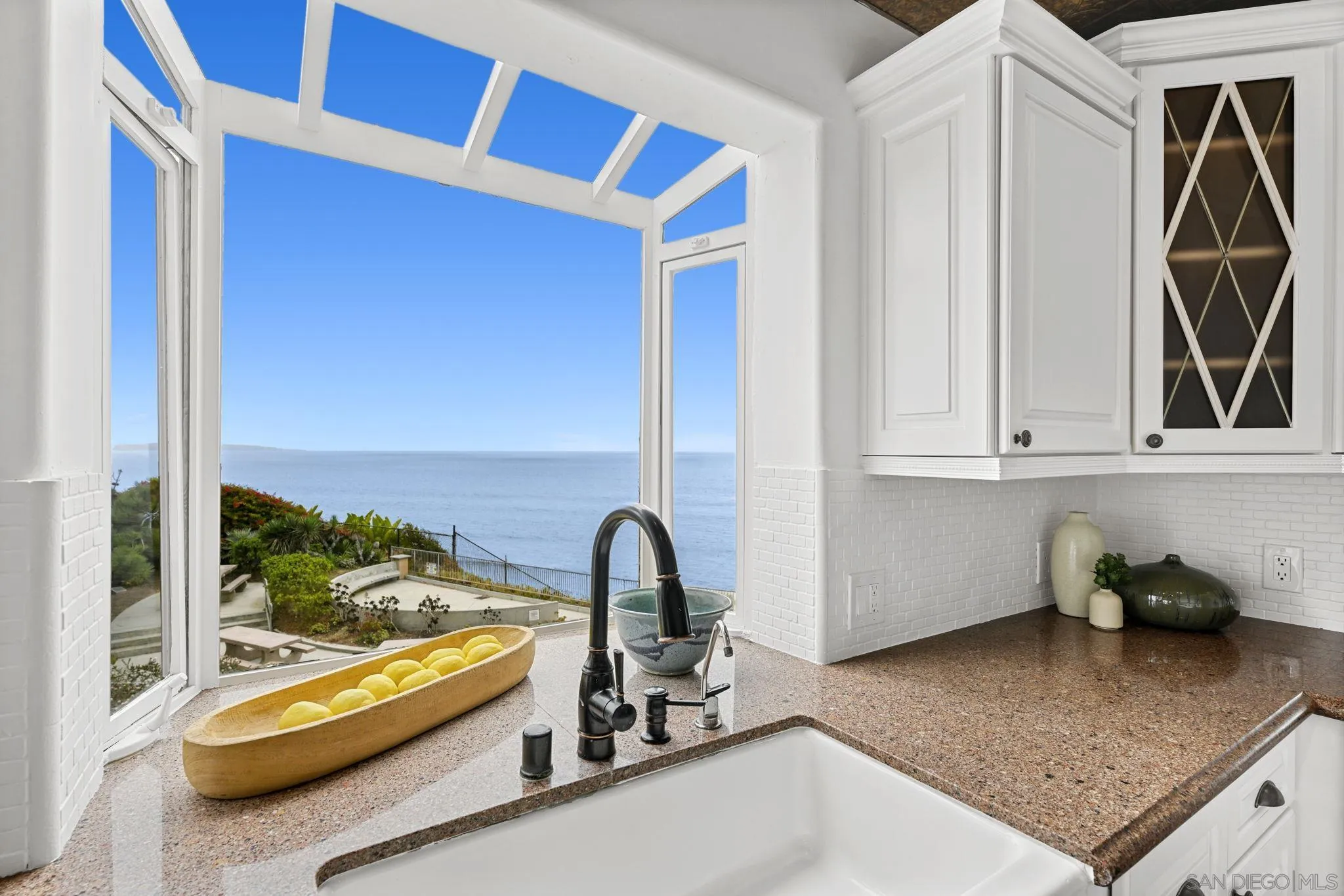 337 West I Street Encinitas, CA 92024 - Photo 19 of 58 a kitchen with a sink and a window