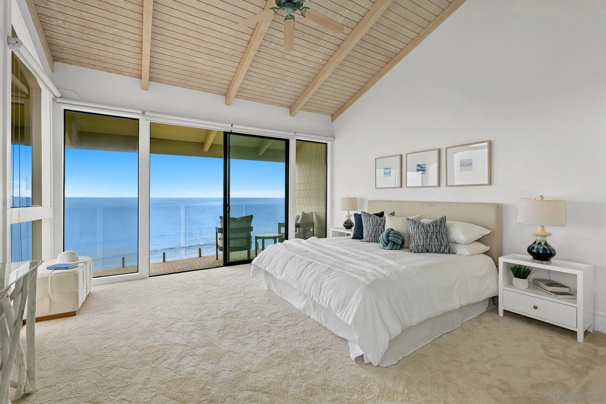 337 West I Street Encinitas, CA 92024 - Photo 29 of 58 a spacious bedroom with a bed and a large window