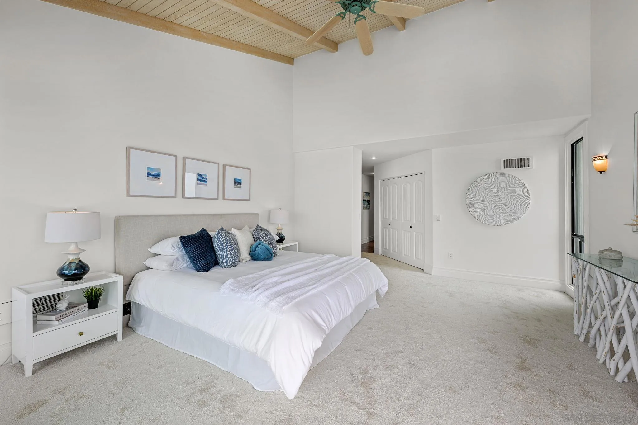 337 West I Street Encinitas, CA 92024 - Photo 31 of 58 a bedroom with a bed and a chandelier