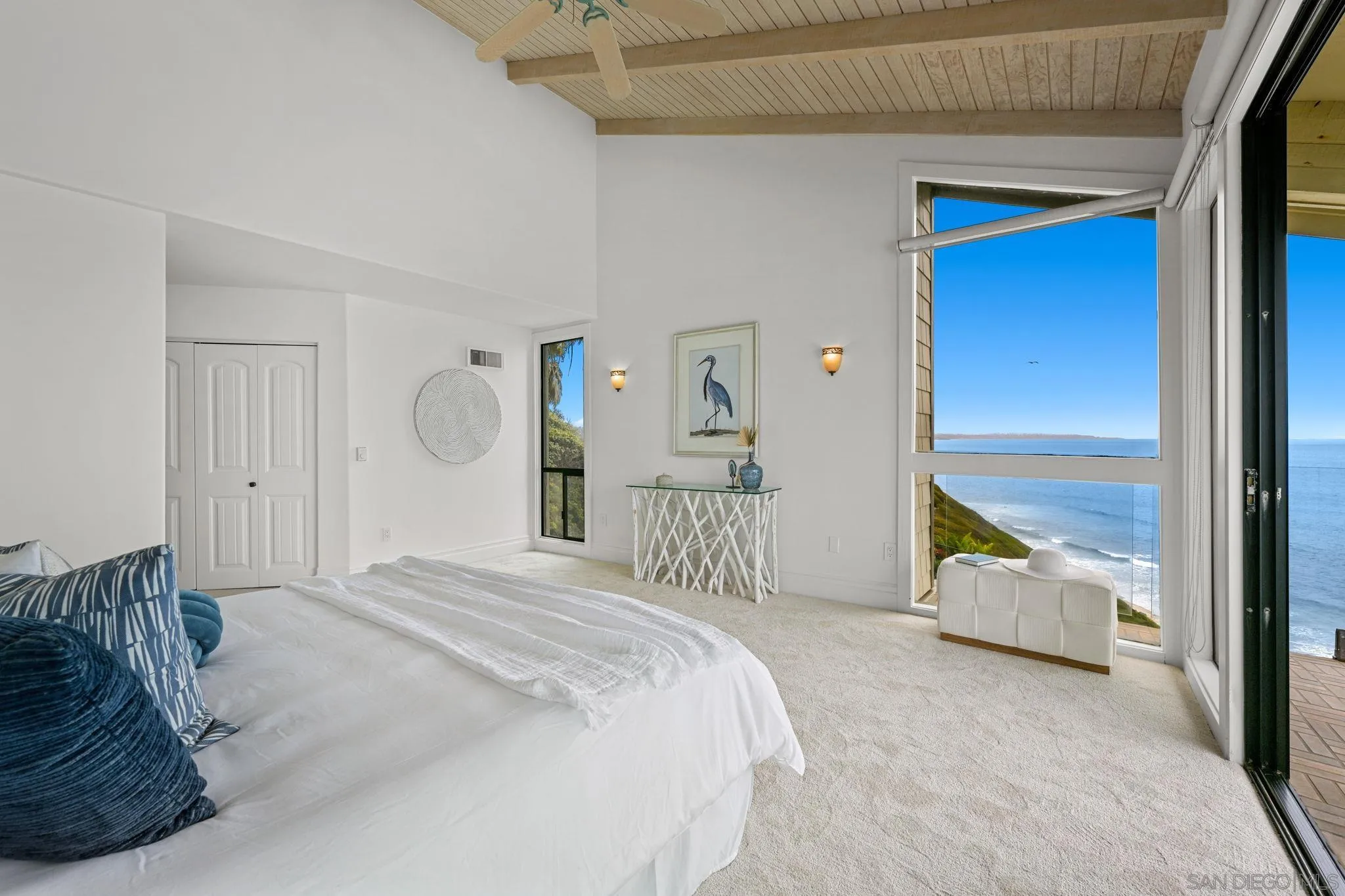 337 West I Street Encinitas, CA 92024 - Photo 32 of 58 a bedroom with a bed and large windows