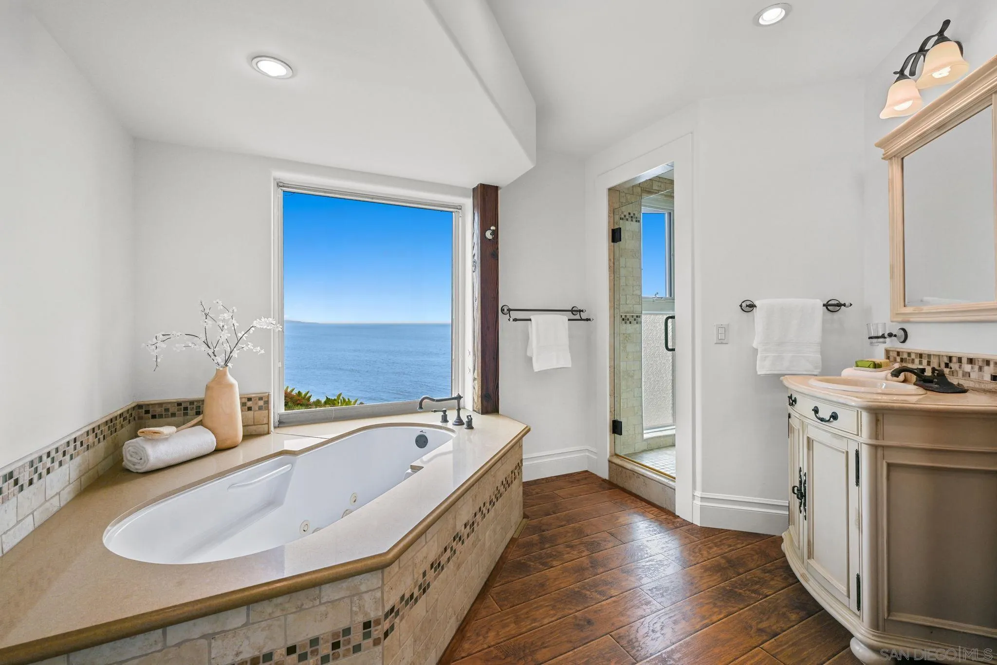 337 West I Street Encinitas, CA 92024 - Photo 37 of 58 a spacious bathroom with a tub sink and mirror