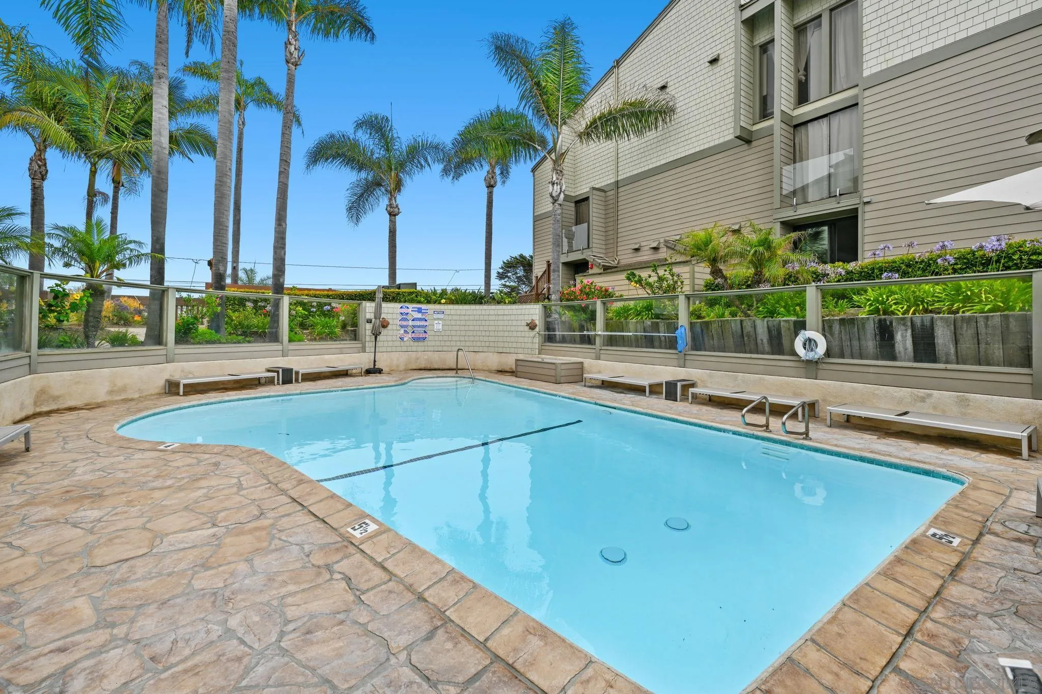 337 West I Street Encinitas, CA 92024 - Photo 44 of 58 a swimming pool with outdoor seating and yard