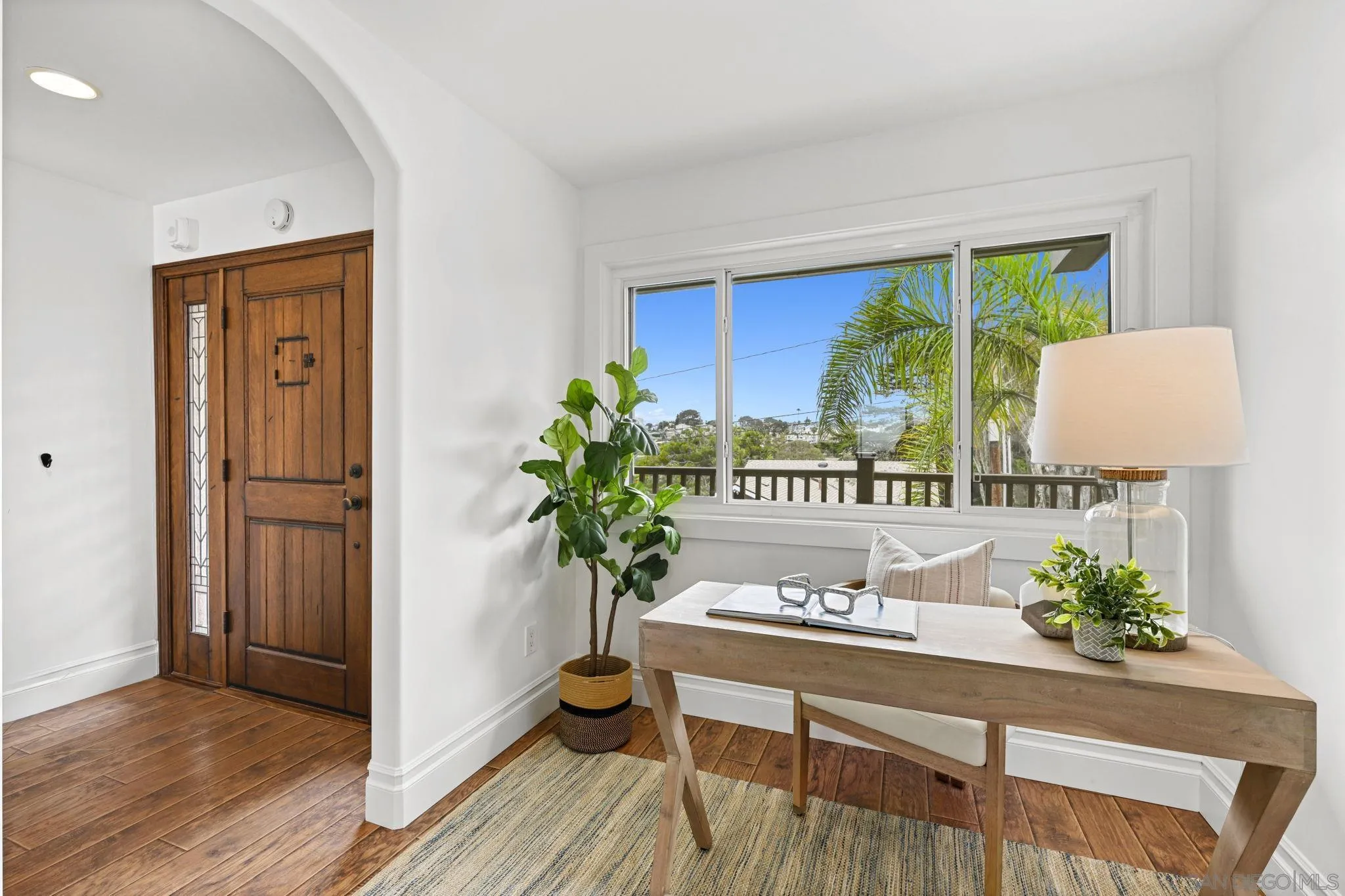 337 West I Street Encinitas, CA 92024 - Photo 7 of 58 a living room with furniture and a potted plant