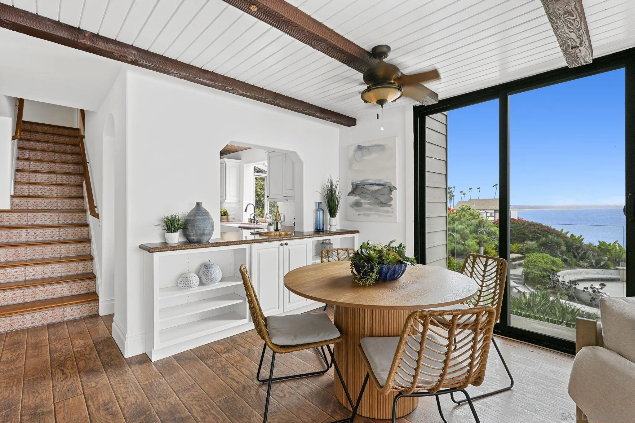 337 West I Street Encinitas, CA 92024 - Photo 9 of 58 a dining room with furniture and a floor to ceiling window