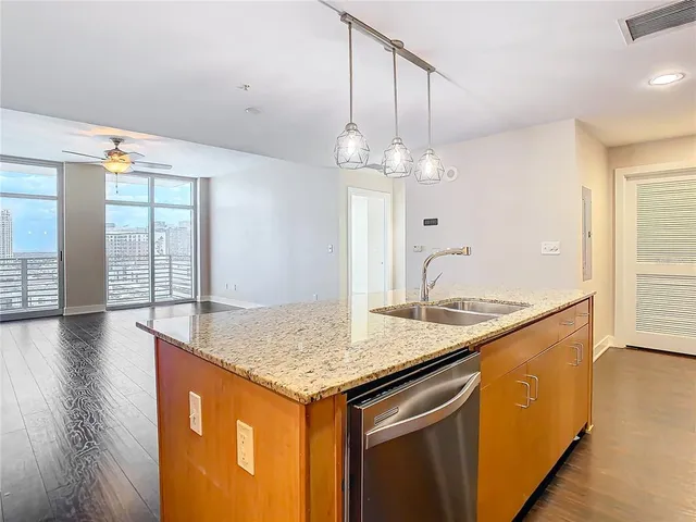 a view of kitchen with cabinets and wooden floor