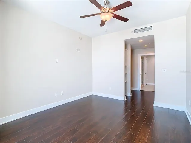 a view of hallway with wooden floor