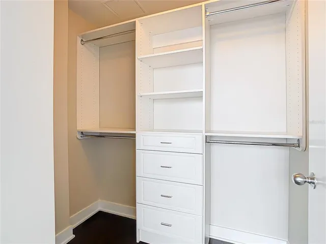 a view of a room with balcony and floor to ceiling window