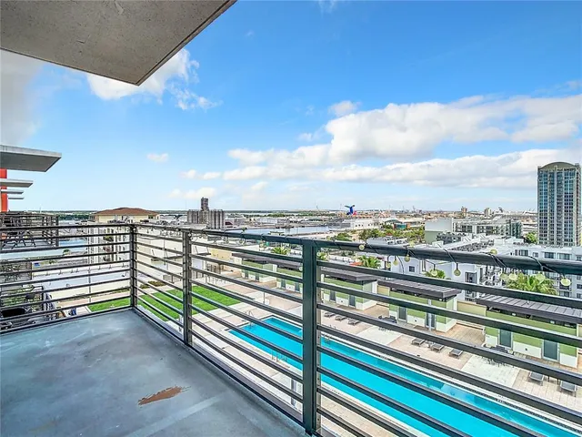 a view of a chairs and table in the balcony