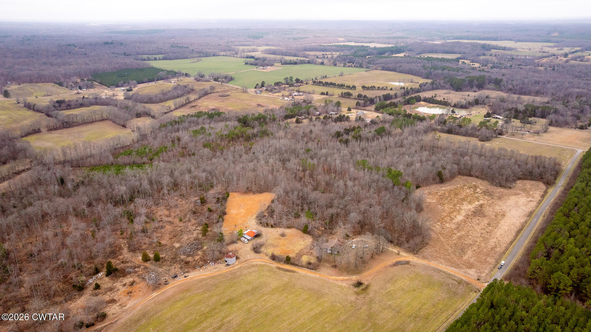 0 Mann Road Hollow Rock, TN 38342 - Photo 3 of 10 an aerial view of a house with a yard