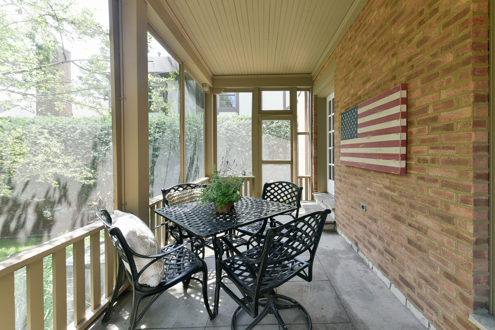 411 Ridge Road Kenilworth, IL 60043 - Photo 13 of 35 a view of a porch with furniture and wooden floor