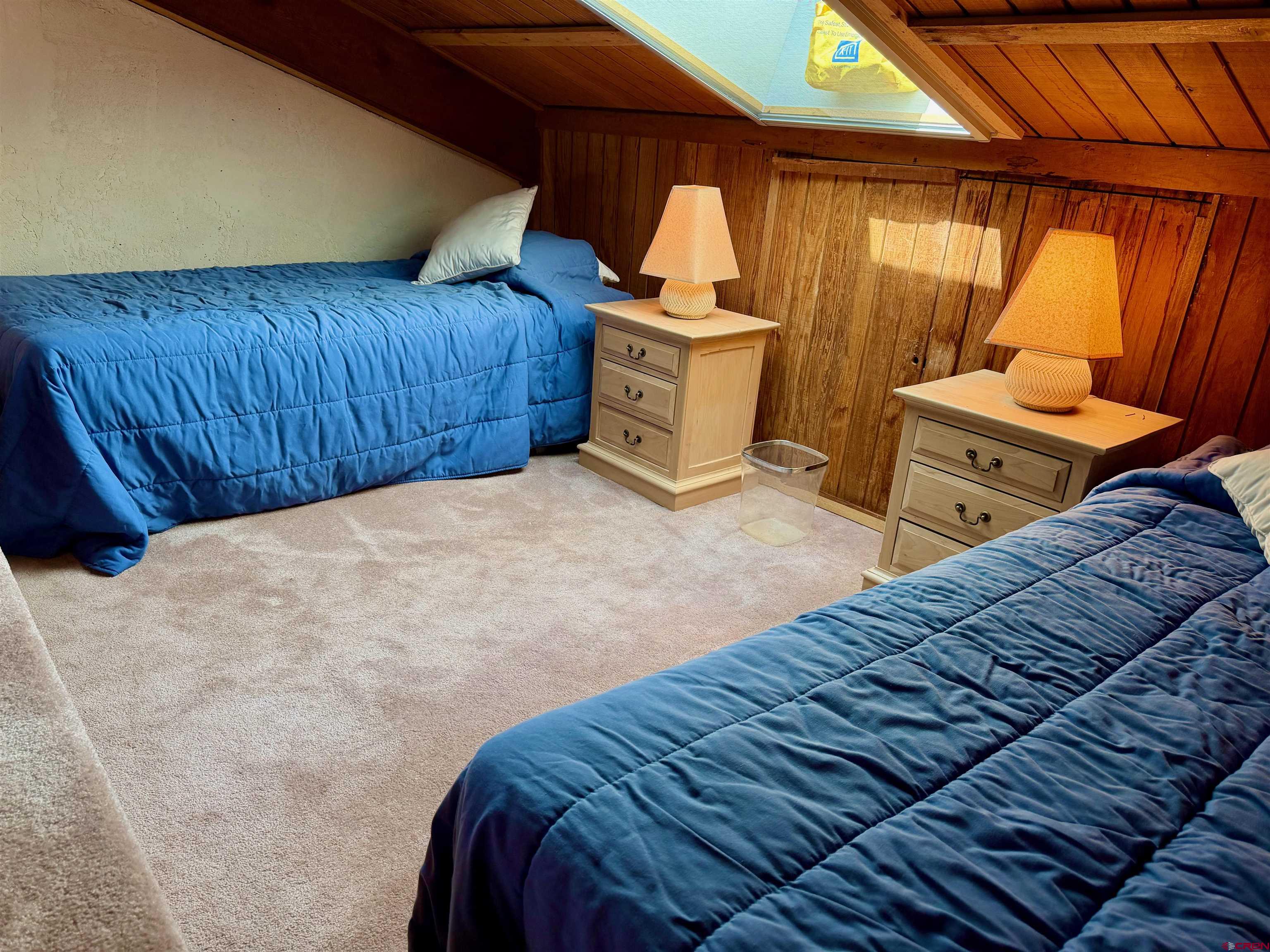51 Whetstone Road, Unit 2306 Crested Butte, CO 81225 - Photo 33 of 44 a bed sitting in a bedroom next to a window