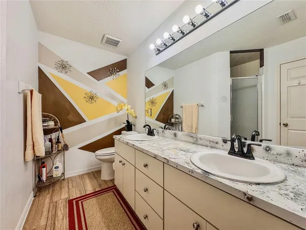 a bathroom with a sink and a large mirror