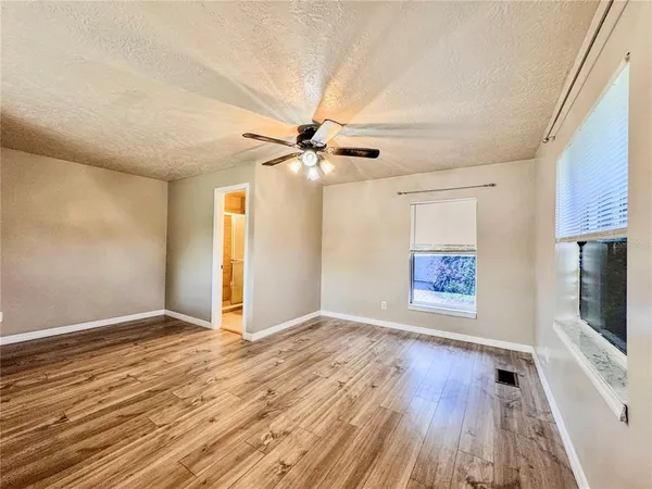 a house view with swimming pool in front of it