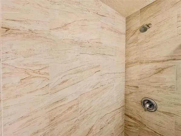 an aerial view of a house with swimming pool and garden