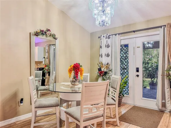 a dining room with furniture and window